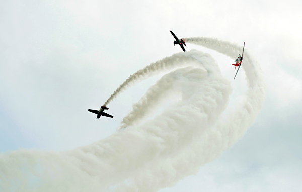 Air planes racing at a demonstration.